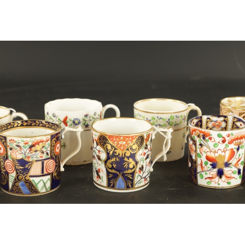 43 - THREE DERBY COFFEE CANS IN IMARI DECORATION CIRCA 1810 AND SEVEN OTHERS (6cm high)