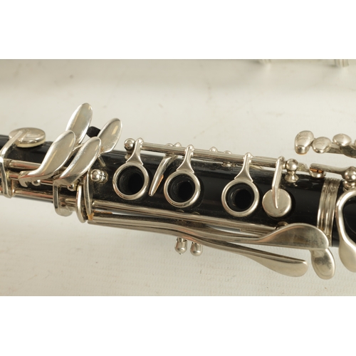 436 - A COLLECTION OF FIVE WIND INSTRUMENTS comprising of a Mistral flute, Selmer 1400 clarinet, a Boosey ... 