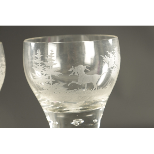 5 - A RARE PAIR OF OVERSIZED EARLY 18TH CENTURY AIR TWIST AND ETCHED WINE GLASSES depicting a hunting do... 