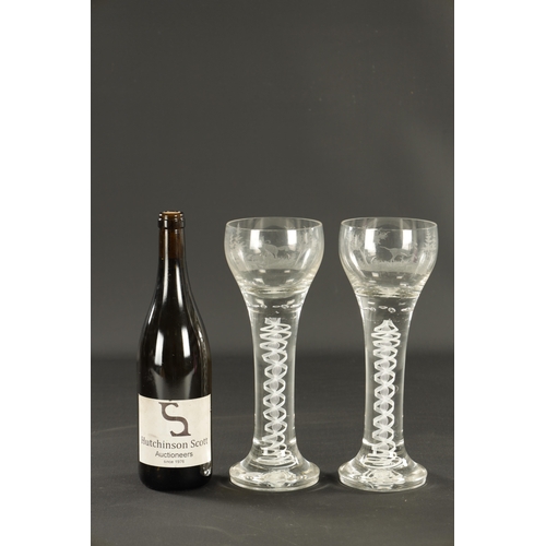 5 - A RARE PAIR OF OVERSIZED EARLY 18TH CENTURY AIR TWIST AND ETCHED WINE GLASSES depicting a hunting do... 