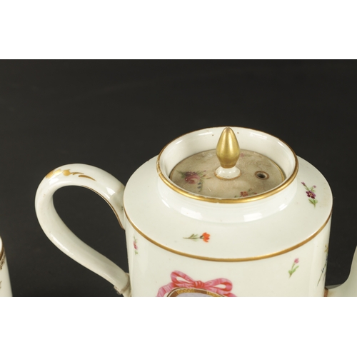 52 - TWO 18TH CENTURY PARIS PORCELAIN CYLINDRICAL TEAPOTS TOGETHER WITH A PARIS COFFEE CUP AND SAUCER PAI... 