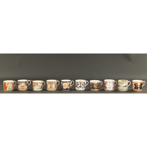 65 - A COLLECTION OF TEN COALPORT COFFEE CANS CIRCA 1810 with elaborate enamel and gilt decoration. (6.3c... 