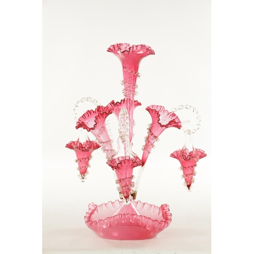 8 - A 19TH CENTURY CRANBERRY GLASS EPERGNE with fluted bodies and hanging baskets (53cm high )