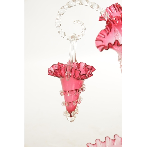 8 - A 19TH CENTURY CRANBERRY GLASS EPERGNE with fluted bodies and hanging baskets (53cm high )