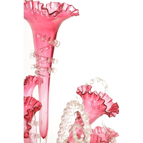 8 - A 19TH CENTURY CRANBERRY GLASS EPERGNE with fluted bodies and hanging baskets (53cm high )