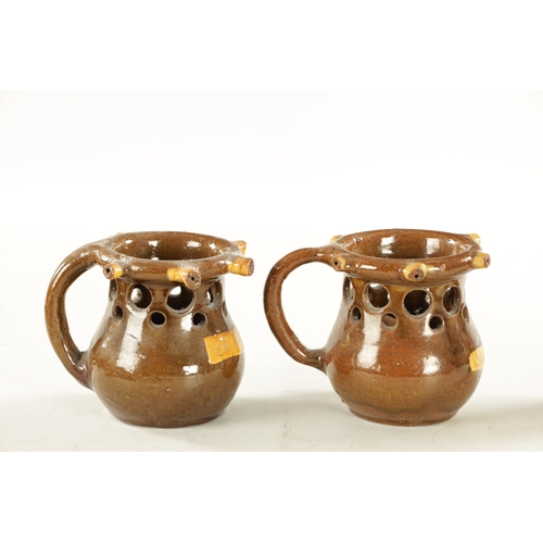 81 - TWO SLIPWARE PUZZLE JUGS CIRCA 1880 (16cm high)