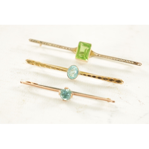 444 - THREE VINTAGE 9CT GOLD BAR BROOCHES, The larger has an emerald cut peridot to the centre, total weig... 