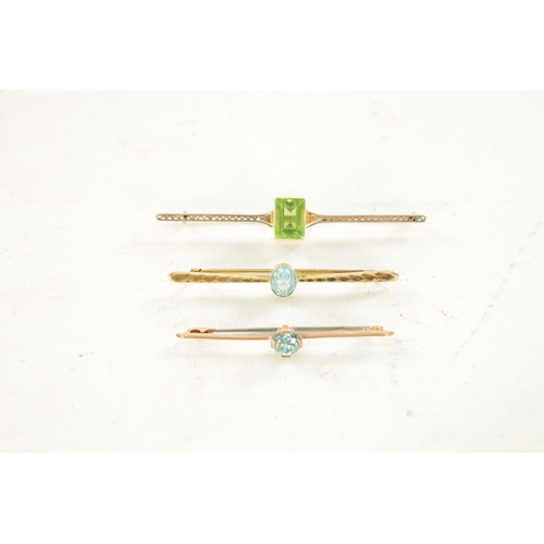 444 - THREE VINTAGE 9CT GOLD BAR BROOCHES, The larger has an emerald cut peridot to the centre, total weig... 