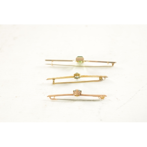 444 - THREE VINTAGE 9CT GOLD BAR BROOCHES, The larger has an emerald cut peridot to the centre, total weig... 