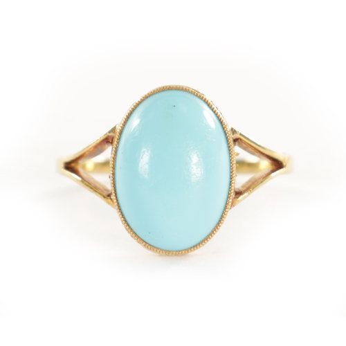 460 - A LADIES VINTAGE 18CT GOLD CABOCHON TURQUOISE RING with scrollwork engraved shank, total weight app.... 