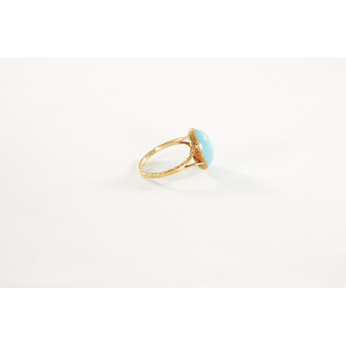 460 - A LADIES VINTAGE 18CT GOLD CABOCHON TURQUOISE RING with scrollwork engraved shank, total weight app.... 