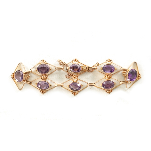 464 - A VINTAGE 9CT GOLD AMETHYST BRACELET total weight app. 11g. (18cm long)