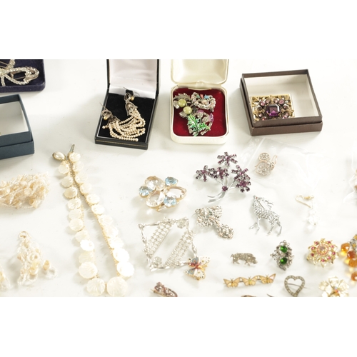 467 - A LARGE COLLECTION OF VINTAGE COSTUME JEWELLERY comprising brooches, necklaces, pendants, earrings a... 