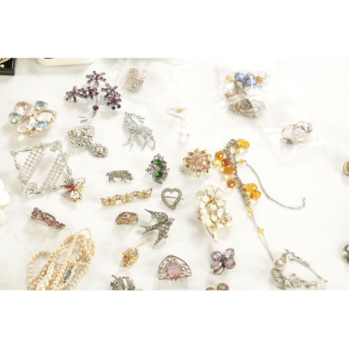 467 - A LARGE COLLECTION OF VINTAGE COSTUME JEWELLERY comprising brooches, necklaces, pendants, earrings a... 