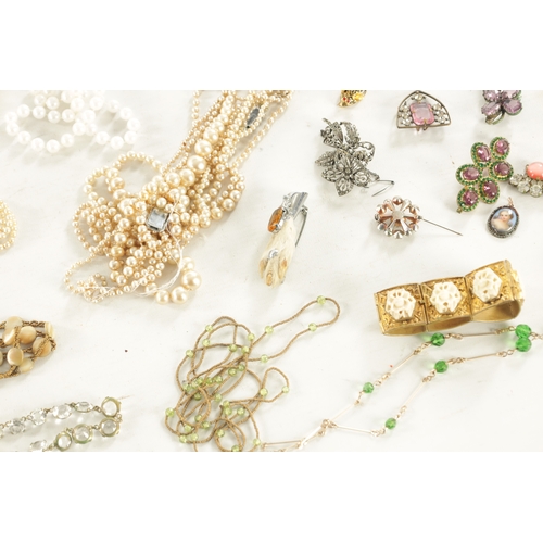 467 - A LARGE COLLECTION OF VINTAGE COSTUME JEWELLERY comprising brooches, necklaces, pendants, earrings a... 