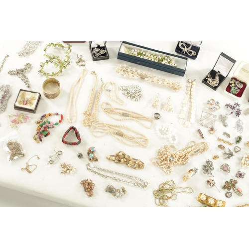 467 - A LARGE COLLECTION OF VINTAGE COSTUME JEWELLERY comprising brooches, necklaces, pendants, earrings a... 