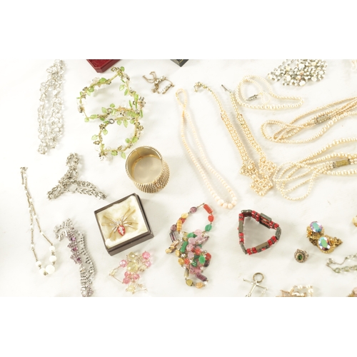 467 - A LARGE COLLECTION OF VINTAGE COSTUME JEWELLERY comprising brooches, necklaces, pendants, earrings a... 