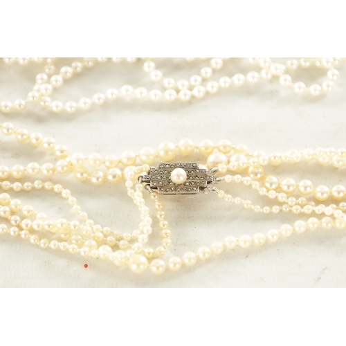 468 - A COLLECTION OF FOUR PEARL NECKLACES AND A PAIR OF EARRINGS one with a 9ct white gold and diamond cl... 