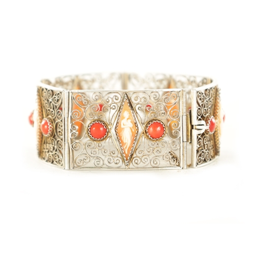 479 - A VINTAGE FRENCH SILVER FILIGREE BRACELET set with cabochon coral and figural cameos. (18.5cm long)