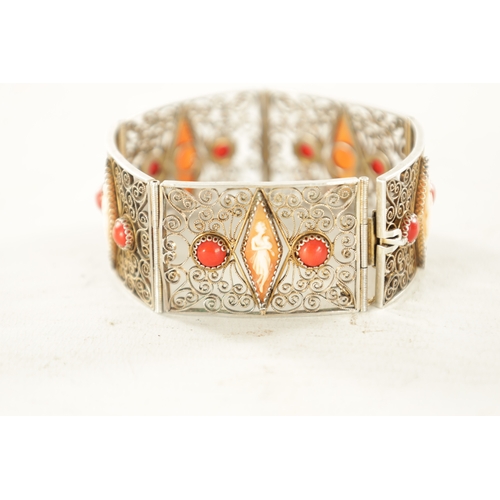 479 - A VINTAGE FRENCH SILVER FILIGREE BRACELET set with cabochon coral and figural cameos. (18.5cm long)