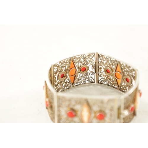 479 - A VINTAGE FRENCH SILVER FILIGREE BRACELET set with cabochon coral and figural cameos. (18.5cm long)