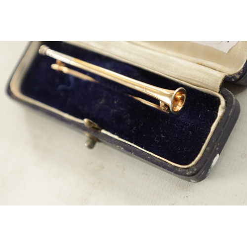 490 - A 15CT GOLD TRUMPET BAR BROOCH with white gold detail, total weight app. 3.8g. (62mm long)