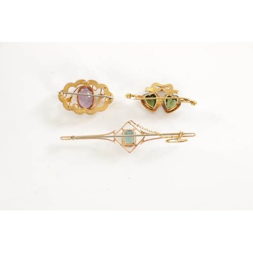 504 - A COLLECTION OF THREE VINTAGE 9CT GOLD BROOCHES comprising of a rose gold bar brooch with aquamarine... 