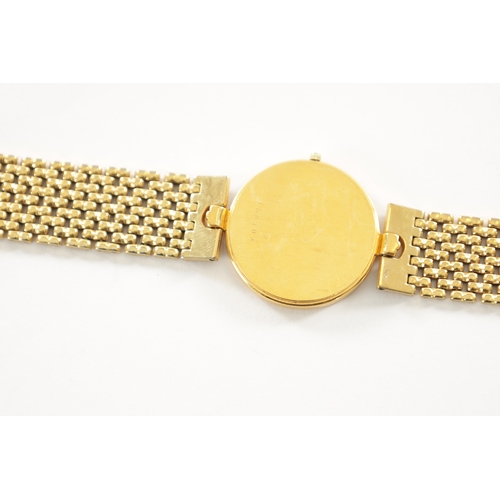 509 - A VINTAGE GOLD PLATED UNIVERSAL-GENEVE WRISTWATCH with original bracelet, the gold honeycomb dial wi... 