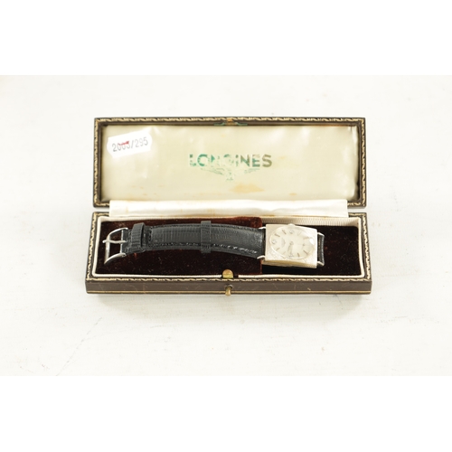 524 - A UNISEX 14CT WHITE GOLD LONGINES WRISTWATCH on black lizard skin strap, the textured case enclosing... 