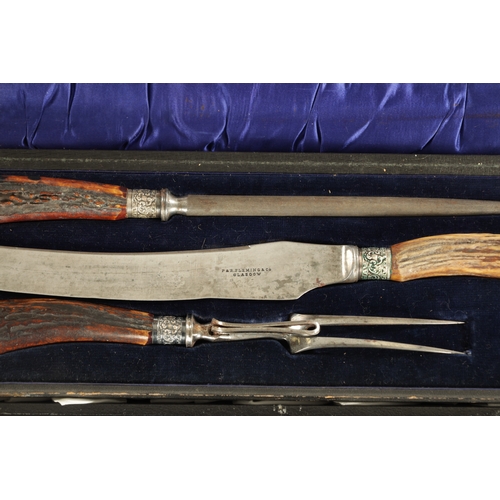 531 - TWO LATE 19TH CENTURY STAGHORN HANDLED CASED CARVING SETS (51cm and 42cm wide )