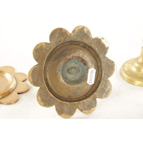 540 - TWO PAIRS OF GEORGE III CIRCULAR BASE BRASS CANDLESTICKS with ejector stems TOGETHER WITH A SHORT PA... 