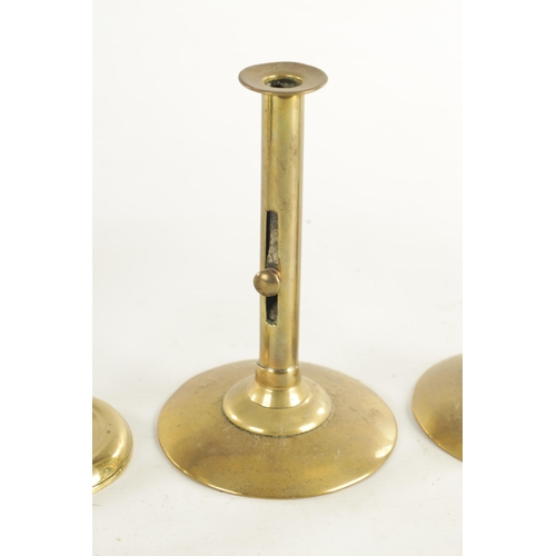 541 - THREE PAIRS OF 18TH CENTURY BRASS PETAL BASE AND EJECTOR STEM CANDLESTICKS and a later pair (petal b... 