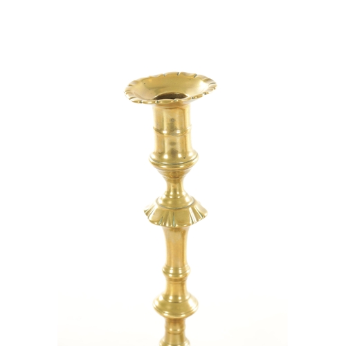 543 - A GOOD PAIR OF EARLY GEORGIAN PETAAL BASED BRASS CANDLESTICKS with ringed knopped stems TOGETHER WIT... 