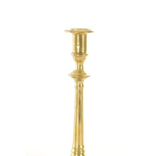 543 - A GOOD PAIR OF EARLY GEORGIAN PETAAL BASED BRASS CANDLESTICKS with ringed knopped stems TOGETHER WIT... 