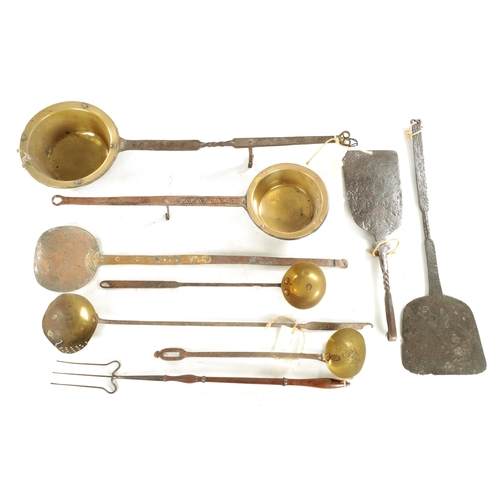 545 - A COLLECTION OF EARLY BRASS AND IRONWORK KITCHENALIA including two down hearth pans, oven slices, la... 