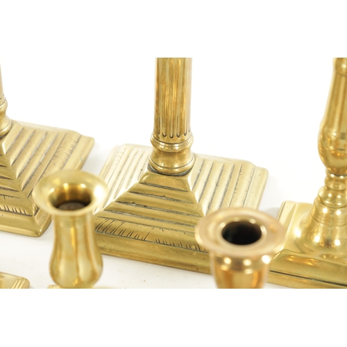 547 - A LARGE PAIR OF GEORGE III STEPPED SQUARE BASE BRASS CANDLESTICKS with stop fluted stems TOGETHER WI... 