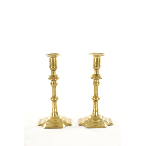 552 - A RARE PAIR OF EARLY 18TH CENTURY “GEORGE GROVE” TWIST EJECTOR STEM SQUARE BASE SEAMED BRASS CANDLES... 