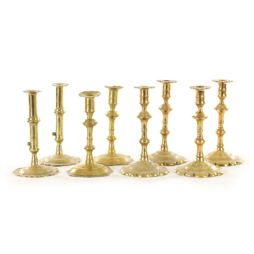 555 - A COLLECTION OF FOUR PAIRS OF EARLY 18TH CENTURY BRASS CANDLESTICKS including a pair with side eject... 