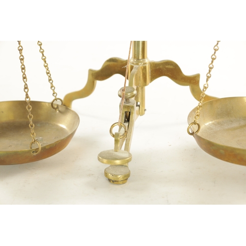 556 - A SET OF 19TH CENTURY BRASS BEAM SCALES plus weights (58cm high )