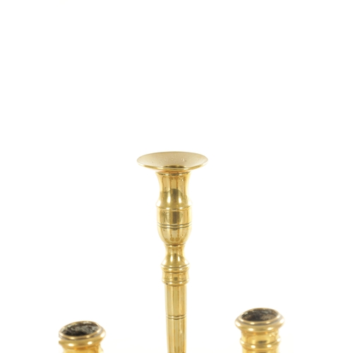 561 - A COLLECTION OF FOUR PAIRS OF 18TH CENTURY STYLE CAST BRASS CANDLESTICKS of various shapes and desig... 