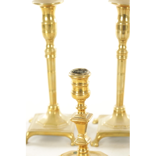 561 - A COLLECTION OF FOUR PAIRS OF 18TH CENTURY STYLE CAST BRASS CANDLESTICKS of various shapes and desig... 