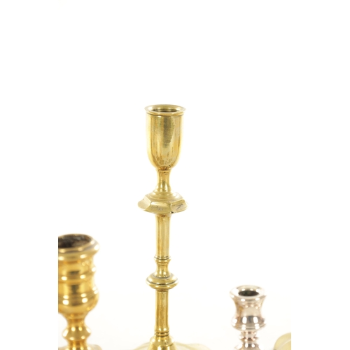 561 - A COLLECTION OF FOUR PAIRS OF 18TH CENTURY STYLE CAST BRASS CANDLESTICKS of various shapes and desig... 