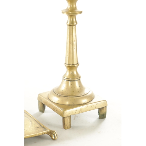 563 - AN EARLY CAST BRASS SPANISH CANDLESTICK TOGETHER WITH A SIMILAR PAIR OF CAST BELL METAL SPANISH CAND... 