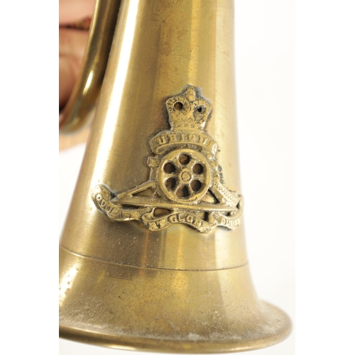 564 - A LARGE BRASS SHIPS BELL monogrammed G R together with a brass military bugle (bell 27cm high bugle ... 