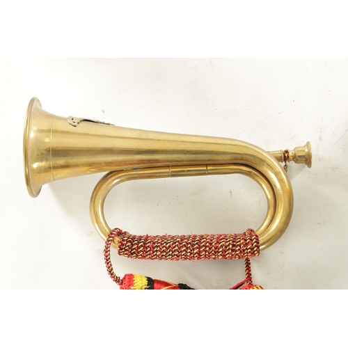 564 - A LARGE BRASS SHIPS BELL monogrammed G R together with a brass military bugle (bell 27cm high bugle ... 