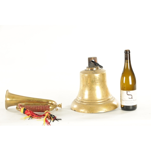 564 - A LARGE BRASS SHIPS BELL monogrammed G R together with a brass military bugle (bell 27cm high bugle ... 