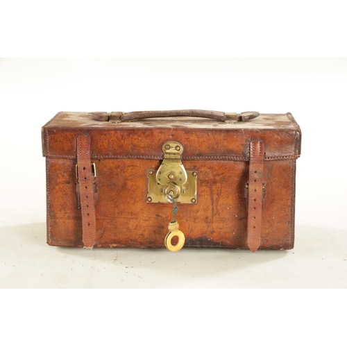 587 - A VINTAGE LEATHER FISHING TACKLE BOX WITH VARIOUS SALMON FLIES having a hinged lid with brass lock, ... 