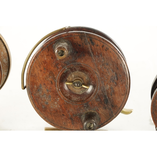 596 - A COLLECTION OF THREE 19TH CENTURY WOOD AND BRASS FISHING REELS, one by Alvey with a 4