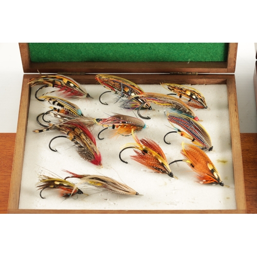 599 - A COLLECTION OF FOUR CASES CONTAINING VARIOUS VINTAGE SALMON FISHING FLIES (longest box measures 66c... 