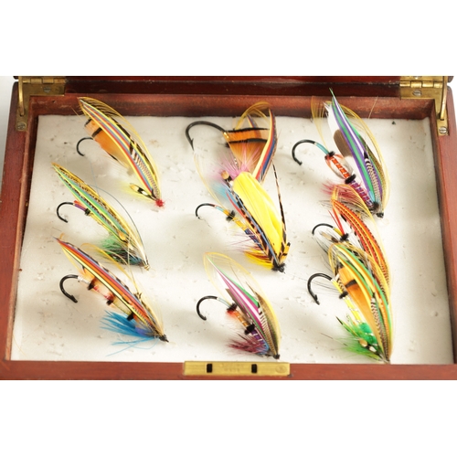 599 - A COLLECTION OF FOUR CASES CONTAINING VARIOUS VINTAGE SALMON FISHING FLIES (longest box measures 66c... 